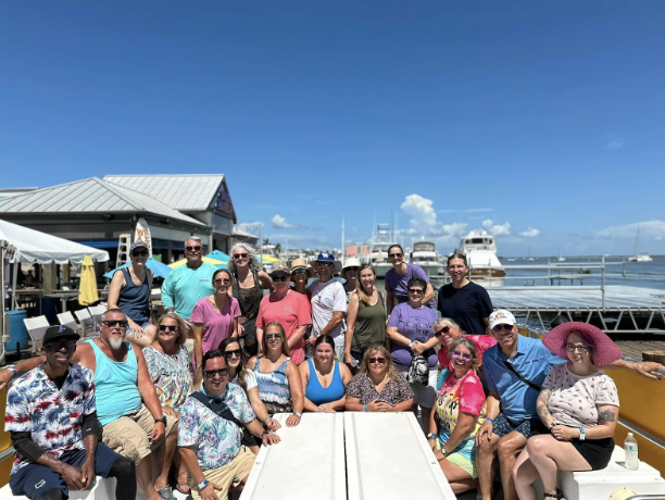 Bob and Sheri on a boat in Fort Myers, Florida with winners from the teacher salute conest